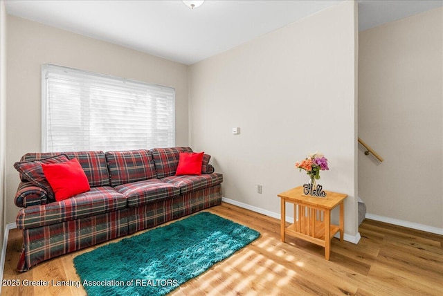 1128 Hickory St, Lansing, MI 48912 - living room featuring wood finished floors and baseboards