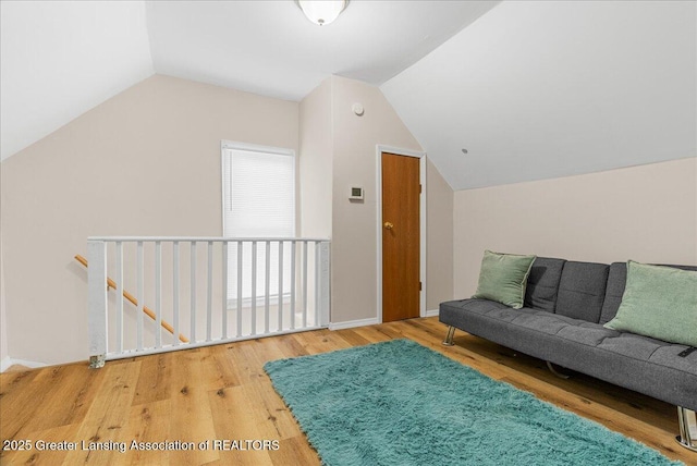 1128 Hickory St, Lansing, MI 48912 - bonus room featuring wood finished floors, lofted ceiling, and baseboards