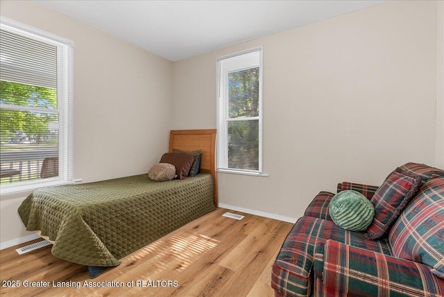 1128 Hickory St, Lansing, MI 48912 - bedroom featuring wood finished floors and baseboards