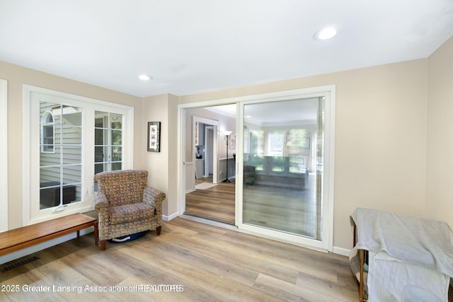 2038 Woodfield Rd, Okemos, MI 48864 - sitting room with wood finished floors, recessed lighting, and baseboards