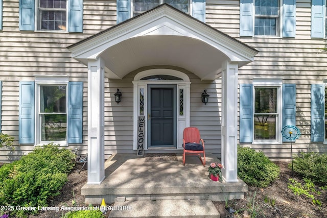 2038 Woodfield Rd, Okemos, MI 48864 - view of exterior entry featuring covered porch