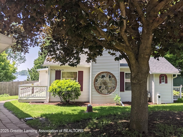15632 Park Lake Rd, East Lansing, MI 48823 - obstructed view of property featuring roof with shingles