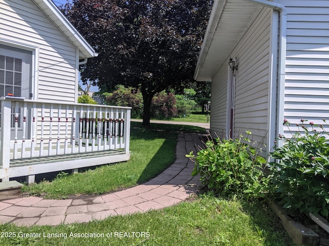 15632 Park Lake Rd, East Lansing, MI 48823 - view of green lawn featuring a wooden deck