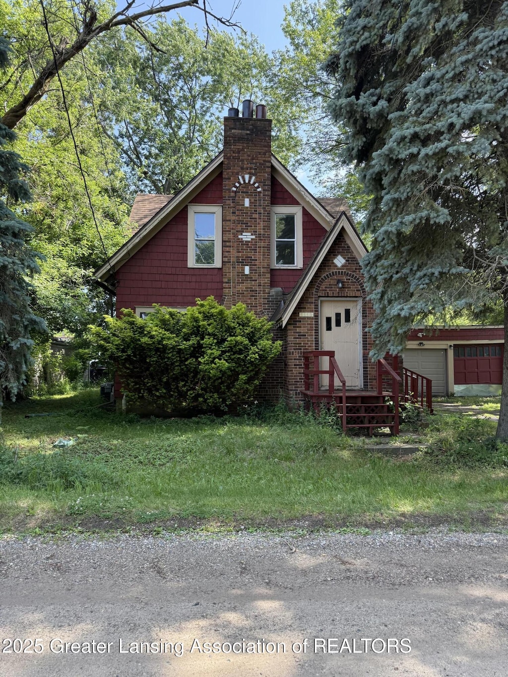 1113 Eaton Ct, Lansing, MI 48910 - view of front of house with a chimney
