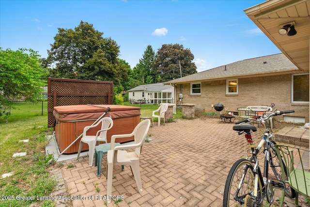 5195 E Brookfield Dr, East Lansing, MI 48823 - view of patio with a hot tub