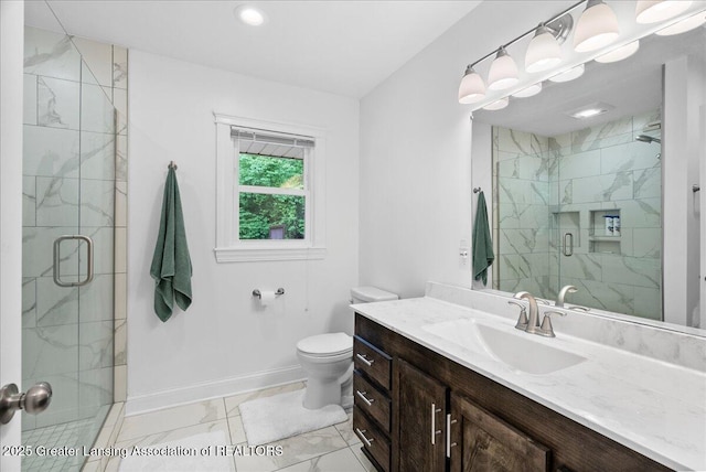 5195 E Brookfield Dr, East Lansing, MI 48823 - bathroom featuring marble look tile flooring, a marble finish shower, vanity, baseboards, and toilet