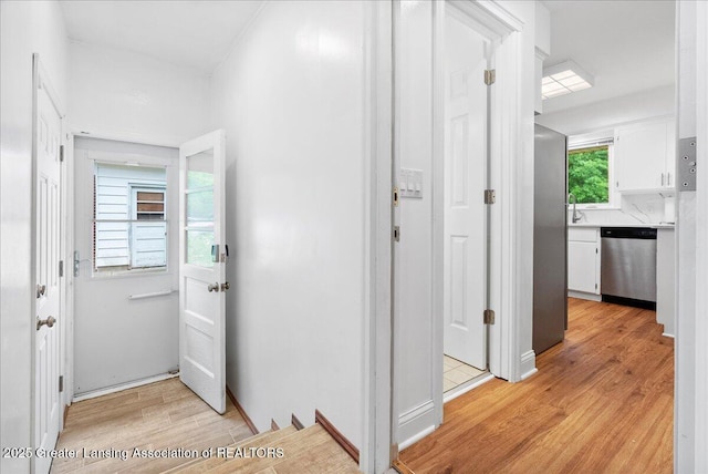 5195 E Brookfield Dr, East Lansing, MI 48823 - hallway featuring light wood-style flooring