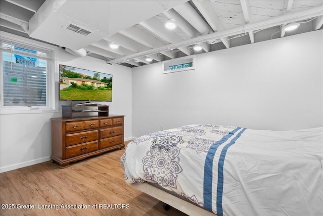 5195 E Brookfield Dr, East Lansing, MI 48823 - bedroom with light wood-type flooring and baseboards