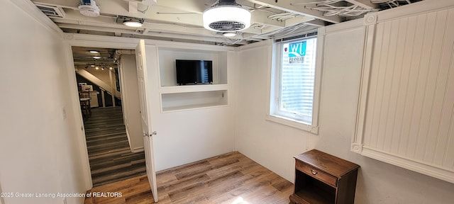 5195 E Brookfield Dr, East Lansing, MI 48823 - basement featuring plenty of natural light and light wood-style floors