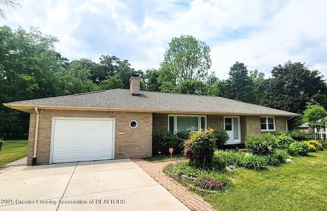 5195 E Brookfield Dr, East Lansing, MI 48823 - single story home with brick siding, a chimney, driveway, and an attached garage