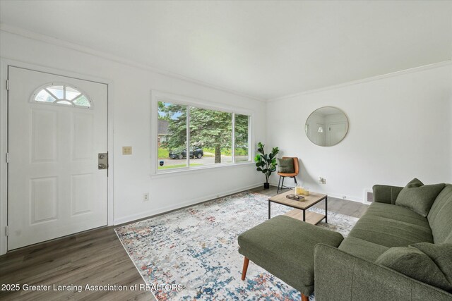 1718 Victor Ave, Lansing, MI 48910 - living room featuring wood finished floors, ornamental molding, and baseboards
