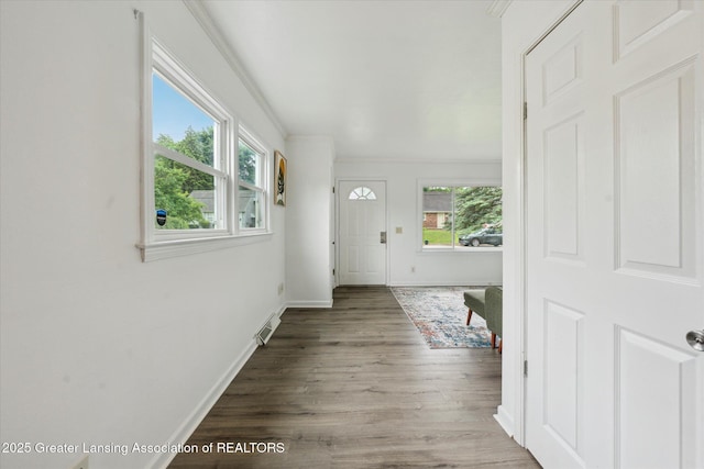 1718 Victor Ave, Lansing, MI 48910 - foyer with wood finished floors, baseboards, and crown molding