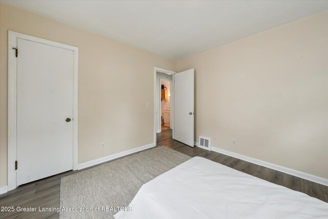 1718 Victor Ave, Lansing, MI 48910 - bedroom featuring wood finished floors and baseboards