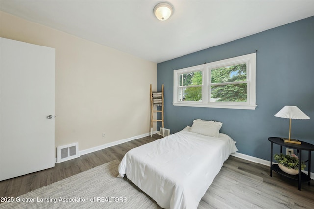 1718 Victor Ave, Lansing, MI 48910 - bedroom with wood finished floors and baseboards