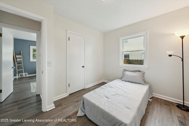 1718 Victor Ave, Lansing, MI 48910 - bedroom featuring wood finished floors and baseboards