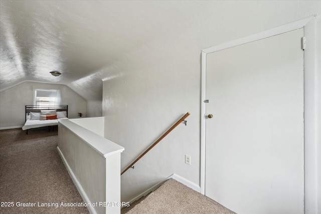 1718 Victor Ave, Lansing, MI 48910 - stairway featuring vaulted ceiling, carpet, and baseboards