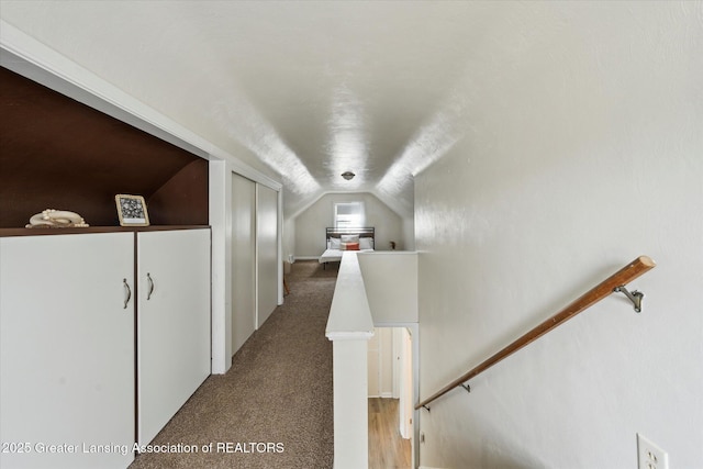 1718 Victor Ave, Lansing, MI 48910 - hall with an upstairs landing, lofted ceiling, and light carpet