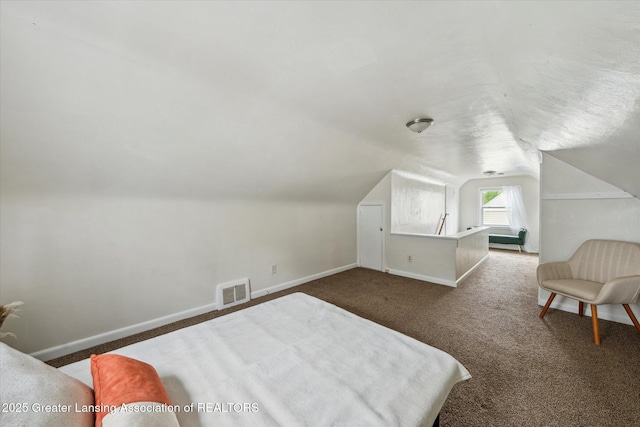 1718 Victor Ave, Lansing, MI 48910 - carpeted bedroom featuring baseboards and lofted ceiling