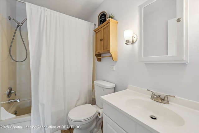 1718 Victor Ave, Lansing, MI 48910 - bathroom featuring vanity, toilet, and shower / bath combo