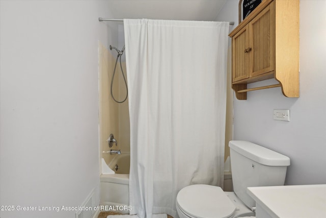 1718 Victor Ave, Lansing, MI 48910 - full bathroom featuring toilet, shower / bath combination with curtain, and vanity