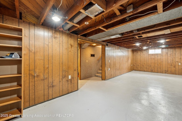 1718 Victor Ave, Lansing, MI 48910 - basement featuring stairway and wooden walls