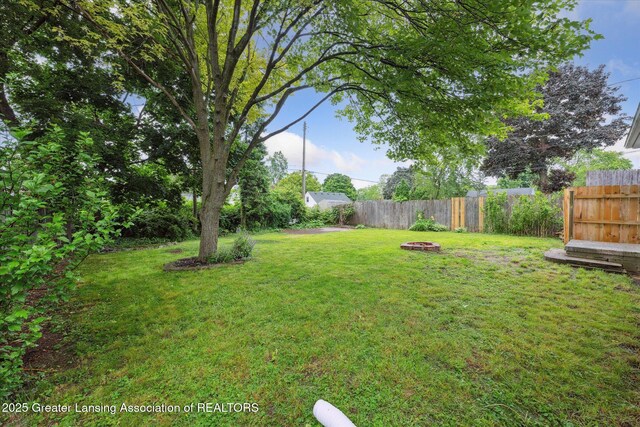 1718 Victor Ave, Lansing, MI 48910 - view of yard with an outdoor fire pit