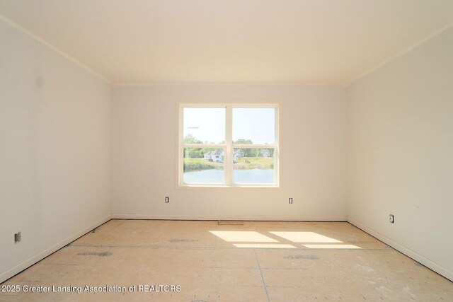 606 Launch Point Dr, Perry, MI 48872 - spare room featuring baseboards