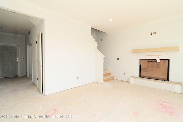 606 Launch Point Dr, Perry, MI 48872 - unfurnished living room featuring stairway