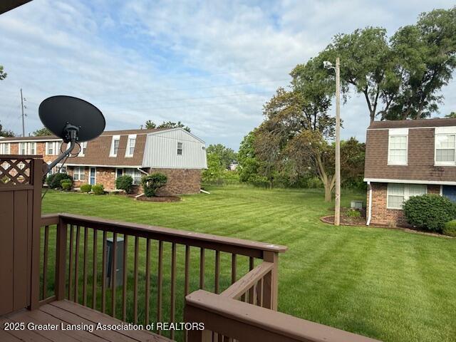 6328 Beechfield Dr, Lansing, MI 48911 - view of grassy yard with a deck