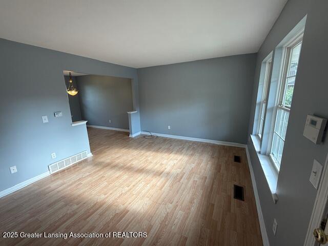 6328 Beechfield Dr, Lansing, MI 48911 - unfurnished room with wood finished floors and baseboards