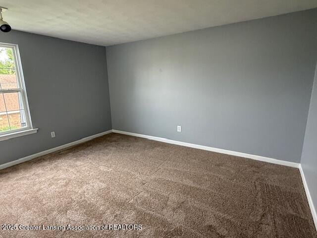 6328 Beechfield Dr, Lansing, MI 48911 - empty room with carpet and plenty of natural light