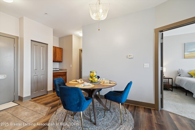 500 E Michigan Ave Unit 417, Lansing, MI 48912 - dining area featuring wood finished floors and baseboards