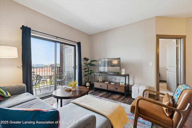 500 E Michigan Ave Unit 417, Lansing, MI 48912 - living room featuring wood finished floors