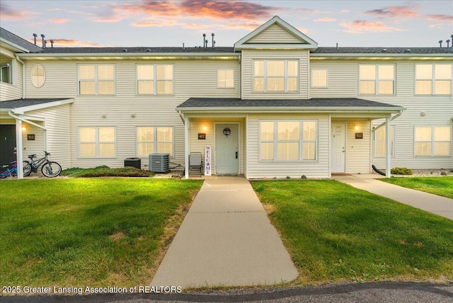 12947 Townsend Dr Unit 412, Grand Ledge, MI 48837 - multi unit property with central air condition unit and a front lawn