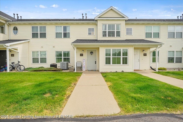 12947 Townsend Dr Unit 412, Grand Ledge, MI 48837 - townhome / multi-family property with central AC and a front yard