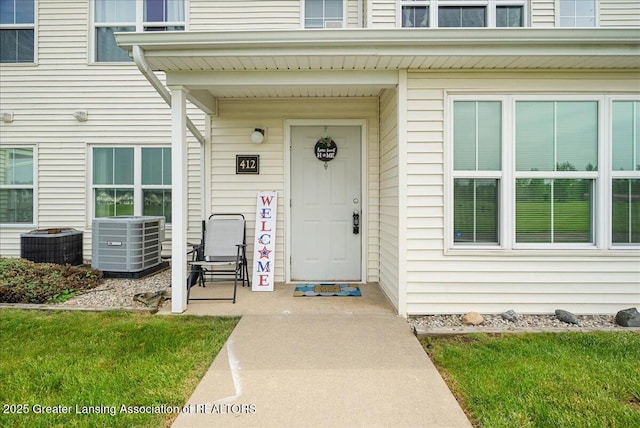 12947 Townsend Dr Unit 412, Grand Ledge, MI 48837 - view of exterior entry featuring central AC