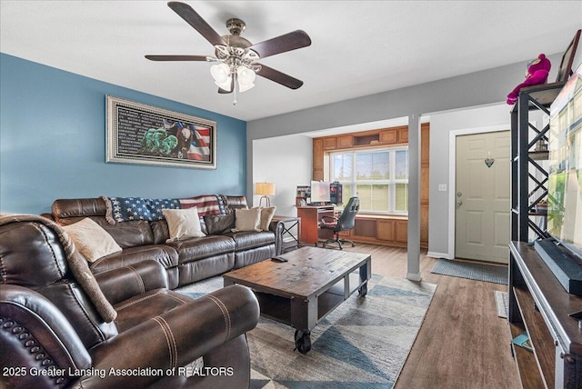 12947 Townsend Dr Unit 412, Grand Ledge, MI 48837 - living area with wood finished floors and a ceiling fan