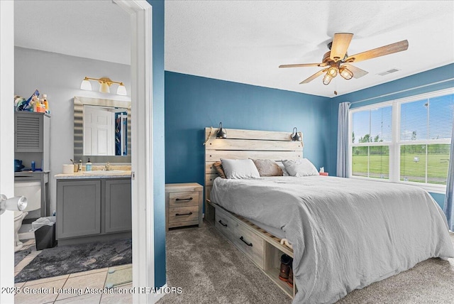 12947 Townsend Dr Unit 412, Grand Ledge, MI 48837 - carpeted bedroom with a ceiling fan and a sink