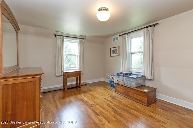 544 Collingwood Dr, East Lansing, MI 48823 - home office with light wood-style flooring and healthy amount of natural light