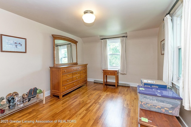 544 Collingwood Dr, East Lansing, MI 48823 - bedroom featuring light wood-style flooring and multiple windows