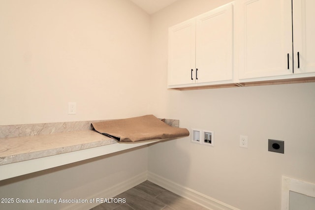 623 Aquila Dr, East Lansing, MI 48823 - laundry room featuring hookup for an electric dryer, cabinet space, baseboards, hookup for a washing machine, and wood finished floors