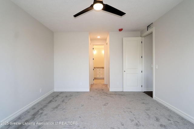 623 Aquila Dr, East Lansing, MI 48823 - unfurnished bedroom with carpet flooring, baseboards, ensuite bathroom, and ceiling fan