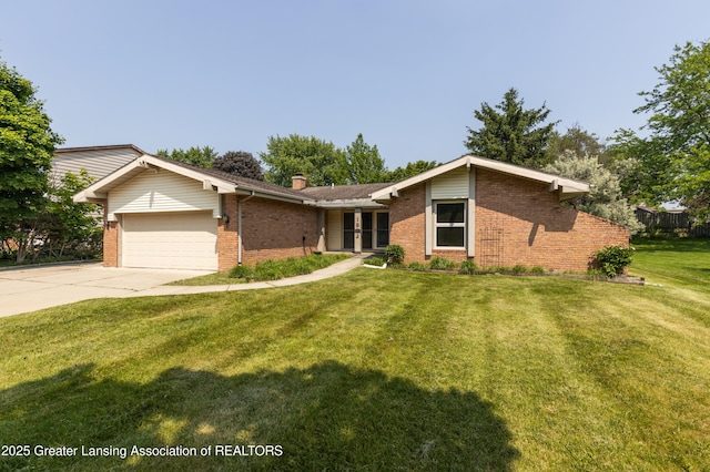 1802 Rockdale Ave, Lansing, MI 48917 - view of front of property featuring brick siding, a garage, driveway, a front lawn, and a chimney