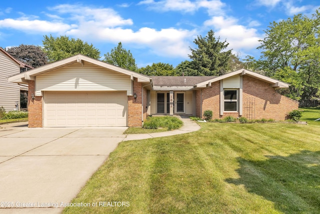 1802 Rockdale Ave, Lansing, MI 48917 - view of front of house featuring brick siding, a garage, driveway, and a front lawn