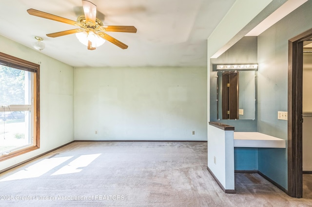 1802 Rockdale Ave, Lansing, MI 48917 - empty room with carpet, ceiling fan, and baseboards