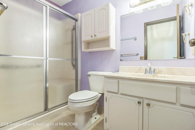 1802 Rockdale Ave, Lansing, MI 48917 - full bathroom featuring vanity, a stall shower, toilet, and tile patterned flooring
