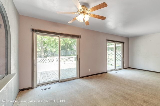1802 Rockdale Ave, Lansing, MI 48917 - carpeted empty room featuring a ceiling fan and baseboards