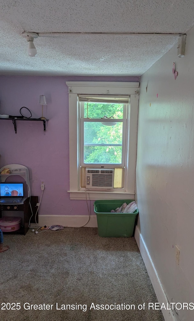 1515 Prospect St, Lansing, MI 48912 - detailed view of carpet floors, cooling unit, baseboards, and a textured ceiling