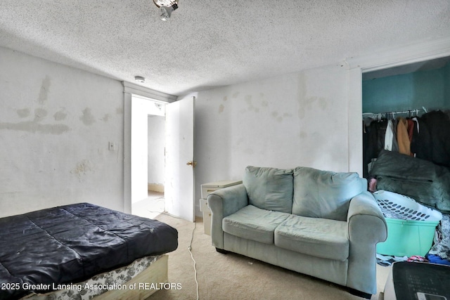 1515 Prospect St, Lansing, MI 48912 - bedroom featuring a closet, a textured ceiling, and carpet