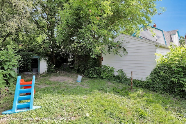 1515 Prospect St, Lansing, MI 48912 - view of green lawn with a shed